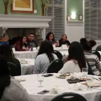 Guests listen to speaker at Life Beyond the Classroom